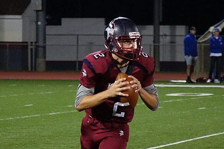 Eastern's Andrew Heck rolling out of the pocket against Washington Township.