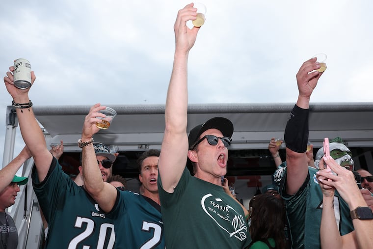 It's Always Sunny in Philadelphia actors Rob Mac (left center) and Glenn Howerton (right center) attend the TrueFan Tailgate before the Eagles play the Cowboys on Thursday at Lincoln Financial Field.