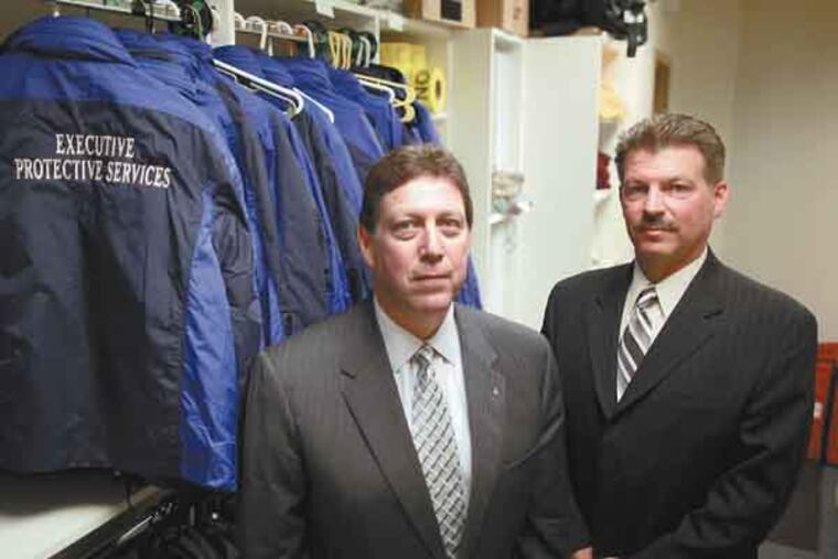 Stuart Visnov ( L ) and Brian Galie of Executive Protective Services, Limerick, Pa., provide safety protection to school districts, April 23, 2013. ( DAVID SWANSON / Staff Photographer )