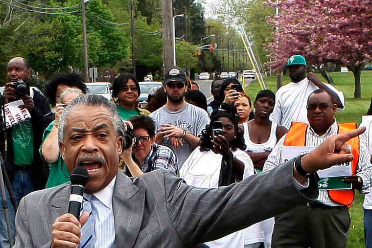 The Rev. Al Sharpton speaks to the crowd at the Vineland Development Center in Vineland, N.J. Gov. Christie's budget calls for its closing.