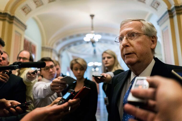 Senate Majority Leader Mitch McConnell talks to journalists about Alabama Senate candidate Roy Moore on Thursday in Washington.
