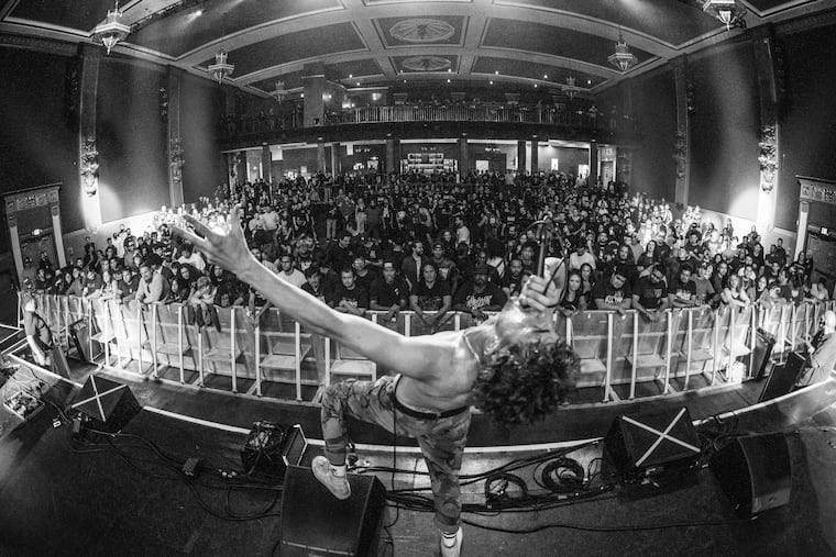 Varials frontman Mitchell Rogers sings at a concert. The band will be playing a concert Oct. 8 at Philly's First Unitarian Church before the launch of their new album, on Oct. 14.