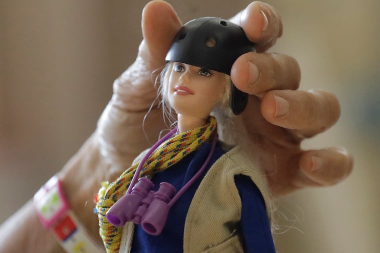 One of the "treetop Barbies" ecologist Nalini Nadkarni created outfitted with miniature versions of her own gear. Fifteen years after she began making the dolls, Mattel asked her to consult on a new line of Barbies with careers in science and conservation. (AP Photo/Rick Bowmer)
