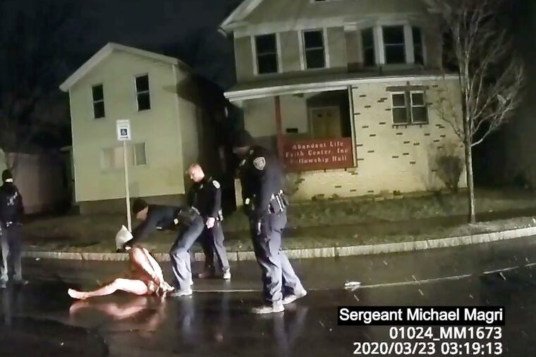 In this image taken from police body camera video provided by Roth and Roth LLP on Sept. 2, 2020, a Rochester police officer puts a hood over the head of Daniel Prude, on March 23, 2020, in Rochester, N.Y.