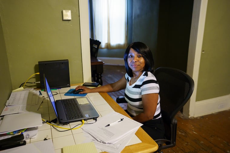 Iona Livingston, a student at Peirce College, uses Comcast's low-cost service for low-income families at her home in West Philadelphia, on Friday, Aug. 5, 2019. Comcast hopes more college students take advantage of the service.