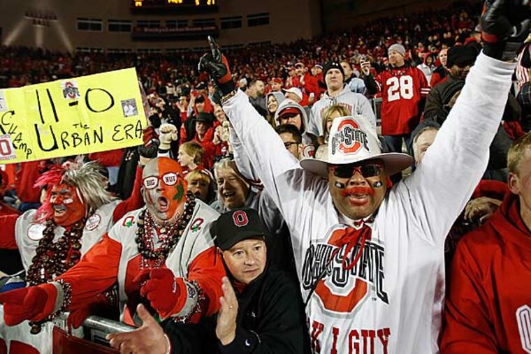 Ohio State fans celebrate after the Buckeyes beat Wisconsin 21-14 in overtime in an NCAA college football game Saturday, Nov. 17, 2012, in Madison, Wis. (Andy Manis/AP)