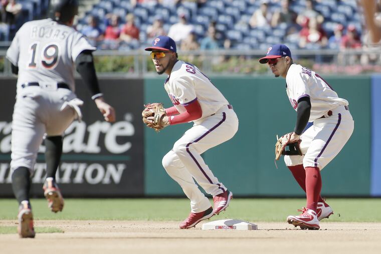 J.P. Crawford and Cesar Hernandez both covered second base in the fourth inning when the Marlins' Starlin Castro hit a ground ball back to pitcher Nick Pivetta. Crawford got the out at second, but his throw to first was so bad, Castro ended up advancing to second base.