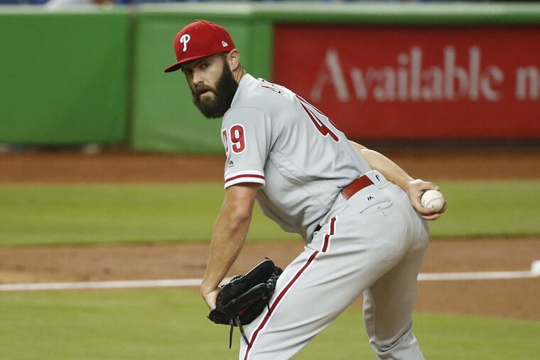 Philadelphia Phillies' Jake Arrieta checks a runner at first during the first inning of a baseball game against the Miami Marlins, Monday, April 30, 2018, in Miami. (AP Photo/Wilfredo Lee)