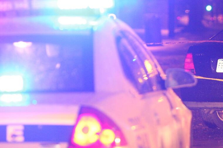 Police scene – Steven M. Falk / Staff Photographer