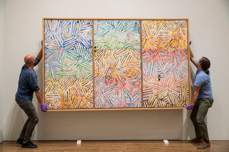 Chris Havlish and Gus Boyce, from the installation and packing department, install "Usuyuki," 1982, by Jasper Johns on loan from Japan at the Philadelphia Museum of Art. The Jasper Johns: "Mind/Mirror" retrospective opens on Sept. 29.