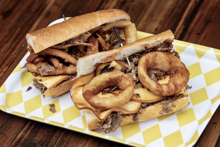 The P'unk sandwich at Nipotina has ribeye steak, Gouda cheese, onion rings, and sauce.