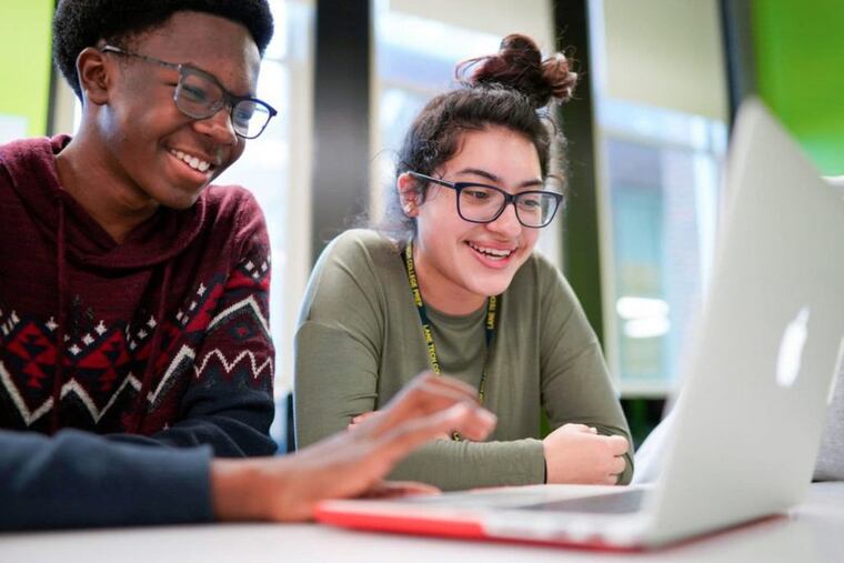 An image provided by Apple shows students at Chicago's Lane Tech College Prep High School learning to build apps using Swift, Apple's programming language.