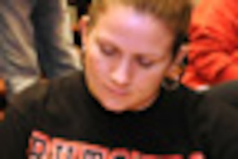 JRUTGERS31P1 At Rutgers Camden, law students get a briefing on he proposed merging with Rowan College. Here, listening and waiting to ask questions at the session are, from left to right: Brian Garrity; Kevin Miller; Amy Melissa Young (seated, foreground); and Lauren Martinez, right. 1/30/12 APRIL SAUL / Staff Photographer