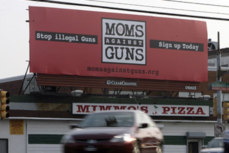The 'Moms against Guns' billboard at 30th and Allegheny in Philadelphia. The space was donated to the group by local advertising firms. (Elizabeth Robertson / Inquirer Staff)