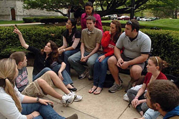 St. Joseph's students meet Wednesday to plan today's protest over denial of tenure to two teachers. (Tiffany Yoon / Staff Photographer)