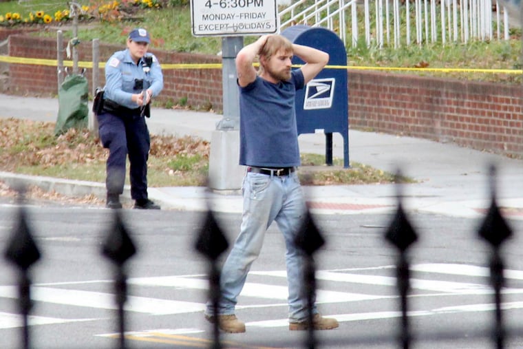 Edgar Maddison Welch, of Salisbury, N.C., surrenders to police in Washington, D.C., on Dec. 4, 2016.