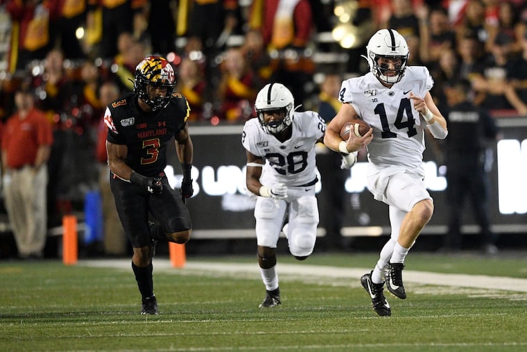 Penn State quarterback Sean Clifford (14), shown scrambling against Maryland, will be tested Saturday by Iowa's defense.
