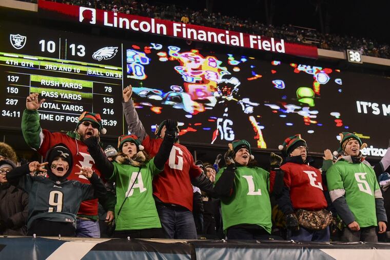 Eagles fans celebrate a play in the game against the Oakland Raider at Lincoln Financial Field in a Monday Night Football game Christmas night 2017. Eagles won 19-10. CLEM MURRAY / Staff Photographer