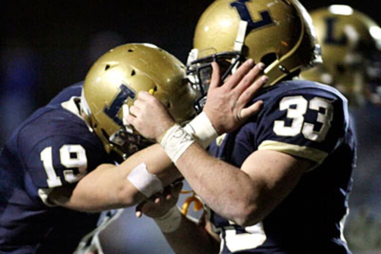 La Salle's MIke Piscopo, left, celebrates a touchdown with teammate Tim Wade. (Elizabeth Robertson/Staff Photographer)
