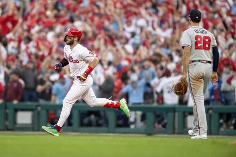 Bryce Harper runs the bases after hitting a home run in the third inning of Game 3 on Friday.