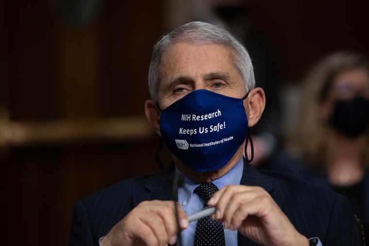 In this Sept. 23, 2020 file photo, Dr. Anthony Fauci, Director of the National Institute of Allergy and Infectious Diseases at the National Institutes of Health, listens during a Senate Senate Health, Education, Labor, and Pensions Committee Hearing on the federal government response to COVID-19 Capitol Hill in Washington. Fauci is recommending masks at Thanksgiving gatherings if the coronavirus status of people is unknown. (Graeme Jennings/Pool via AP)