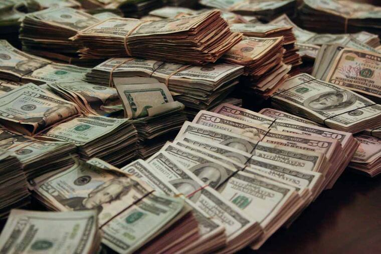 The money that was found in a Jeep Grand Cherokee Laredo. Currently the money sits in the District Attorney's possession along with the jeep parked at corner of S. Penn and South Juniper. (Ashlee Espinal / Staff Photographer)