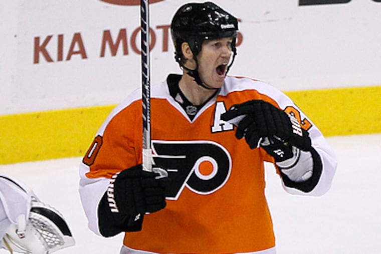 Chris Pronger reacts after being called for a penalty during overtime against the Flames. (AP Photo/Matt Slocum)