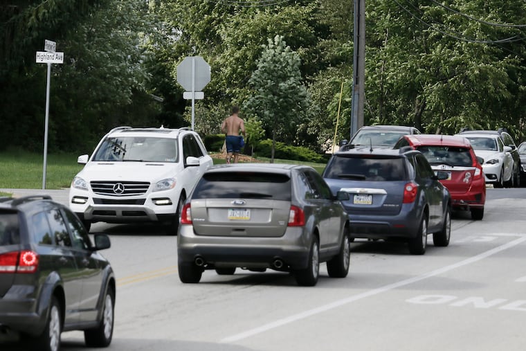 Steady traffic sits at Highland Avenue and Pinetown Road in Fort Washington on a recent weekday afternoon. A proposal by the township to create access from a nearby office park to the streets surrounding it has drawn some debate among residents.
