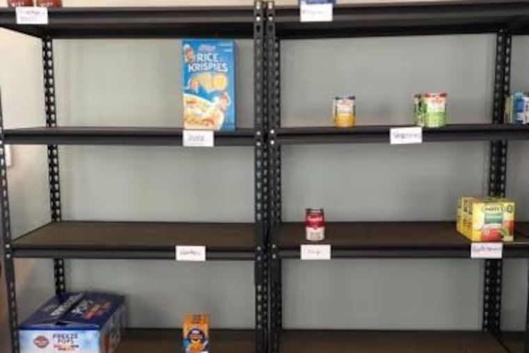 Almost bare shelves at the food pantry of The Angels Community Outreach of Pitman. The pantry had to close temporary this week because of lack of food.
