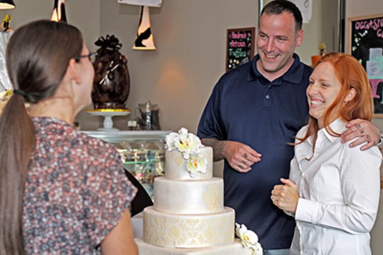 Richard Sambenedetto Jr. and Sarah Carter consult with Kristina Carr at Classic Cake in Cherry Hill. (Akira Suwa / Staff Photographer)