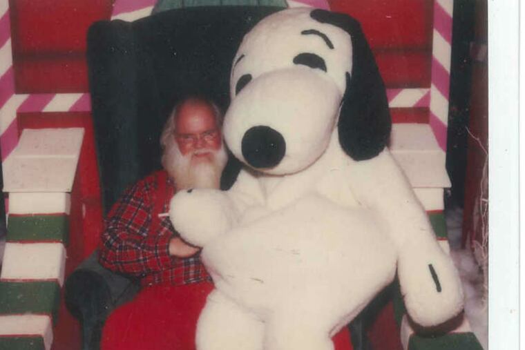 Snoopy (Natalie Pompilio) and Santa share a moment at the mall in Maryland.