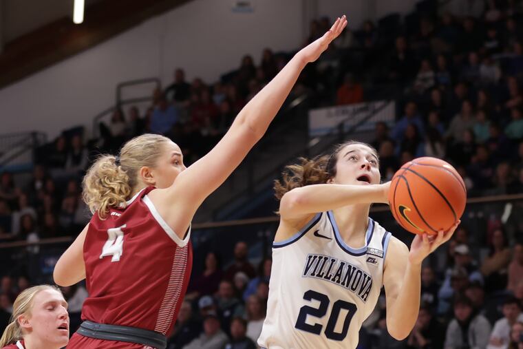 Maddy Siegrist taking a shot against Laura Ziegler of St. Joseph's, had a double-double in Villanova's loss to Iowa State on Sunday.