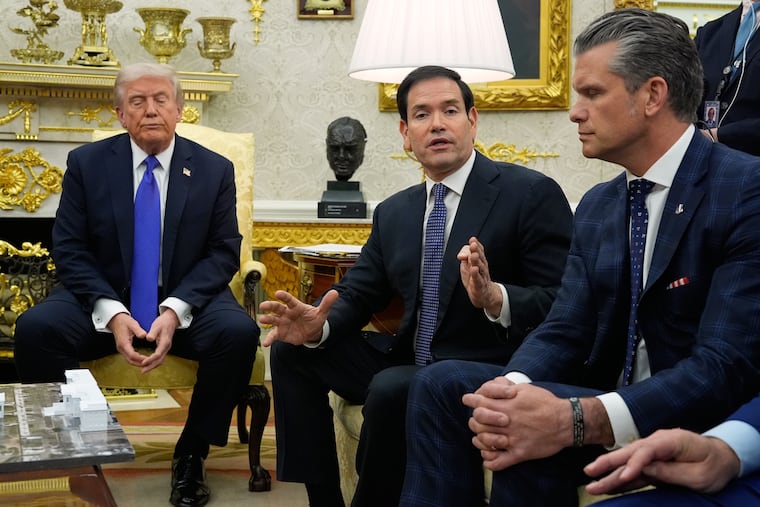 President Donald Trump and Defense Secretary Pete Hegseth listen as Secretary of State Marco Rubio speaks during a meeting with NATO Secretary General Mark Rutte on Oct. 22, 2025, in the White House.