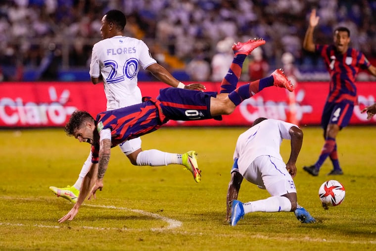 Christian Pulisic (left) suffered an ankle injury during the U.S. men's soccer team's World Cup qualifying game at Honduras on Sept. 8.