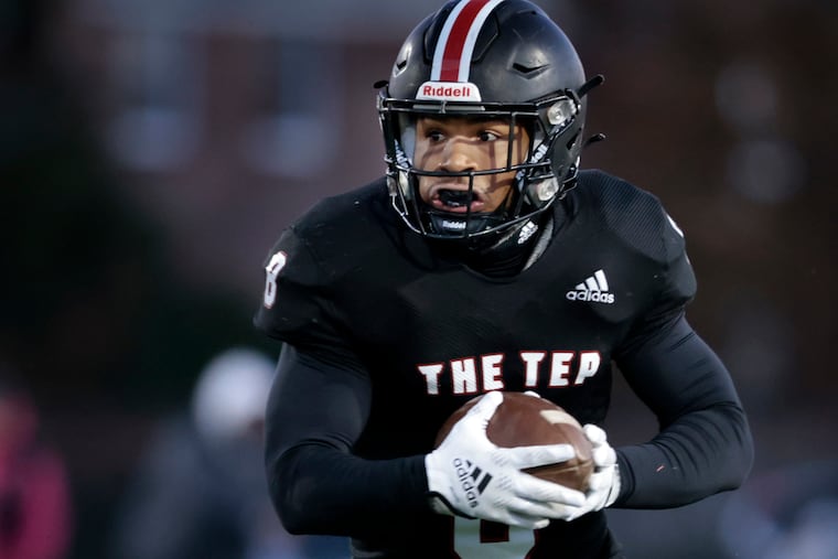 Imhotep Charter's Rahmir Stewart runs the ball during the Imhotep Charter vs. Roman Catholic football PIAA Class 5A playoff game at the Northeast Supersite on Nov. 19.