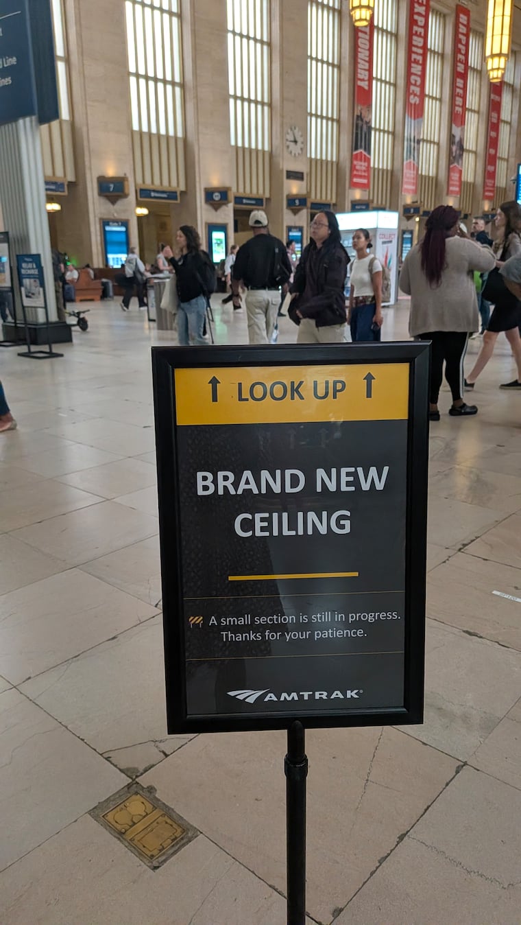 A sign asking people to look up and view the newly restored ceiling at Philadelphia's 30th Street Station. Photo taken on Thursday, Aug. 27, 2026