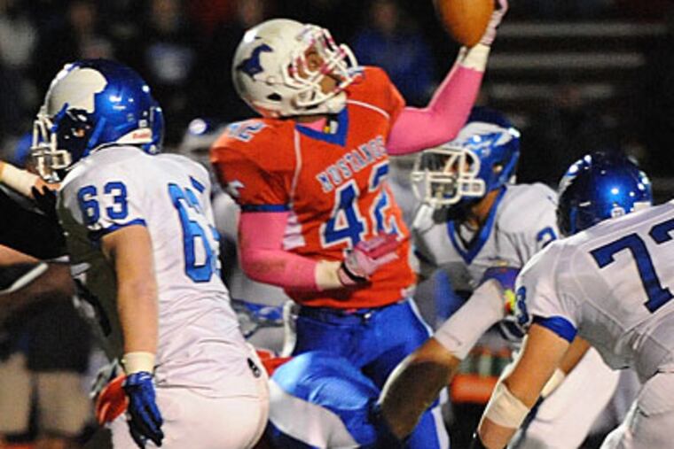 Triton's Isaiah Baylor has the ball fall into his hands after quarterback Alec Vignola fumbled. (Clem Murray/Staff Photographer)