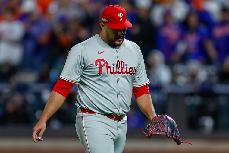 Carlos Estévez walks off of the mound after giving up a grand slam in the sixth inning in Game 4 on Wednesday.