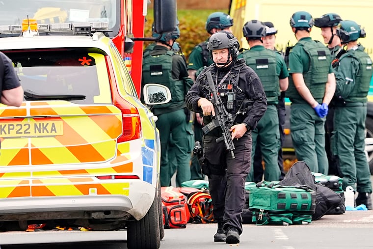 An armed police officer at the scene of a stabbing at Heaton Park Hebrew Congregation synagogue in Crumpsall, Manchester, England, on Thursday.