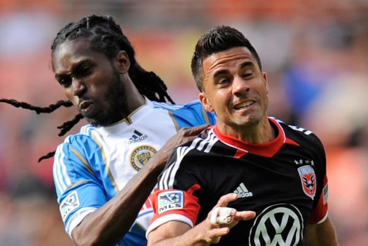 Union midfielder Keon Daniel (back) battles for the ball against D.C. United midfielder Marcelo Saragosa (front) during the first half of an MLS soccer game Sunday, April 21, 2013, in Washington. (Nick Wass/AP)