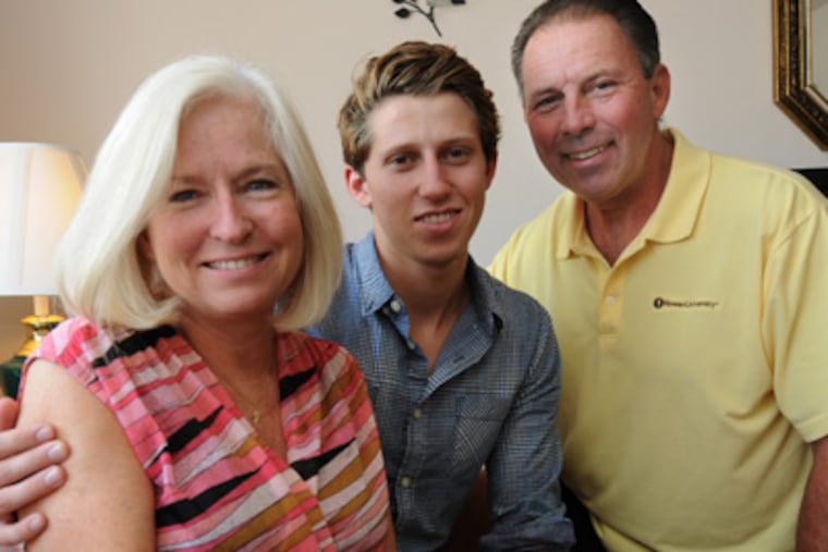 Richie Suarez, with parents Denise and Ralph, was diagnosed with cancer at age 18. APRIL SAUL / Staff Photographer