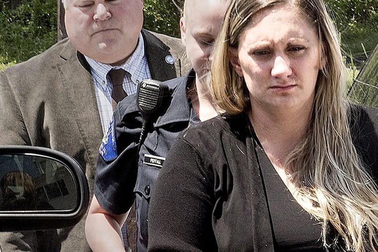 Samantha Jones was led into her district court arraignment in Warwick Township, Pa. on July 13. She was charged with killing her 11-week-old son with drug-laced breast milk.