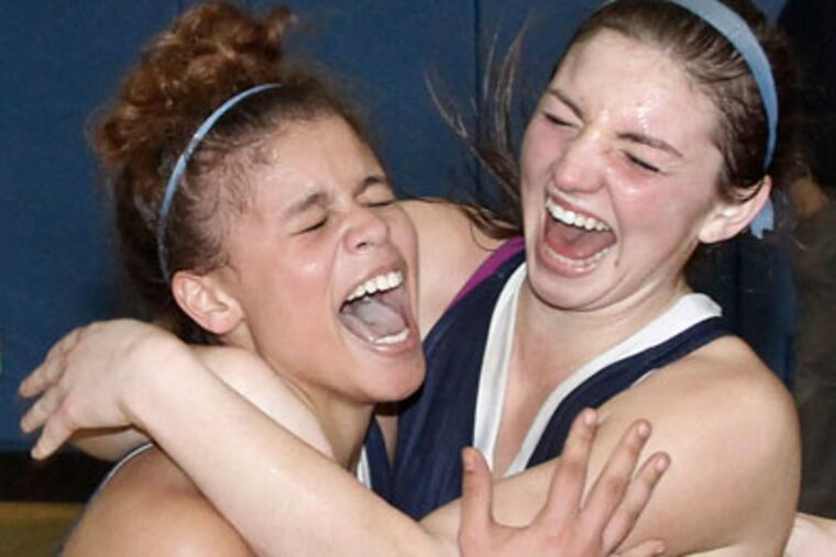 Spring-Ford's Jaida Burgess (left) and Sammy Stipa celebrate after defeating Council Rock South 56-50. (Elizabeth Robertson / Staff Photographer)