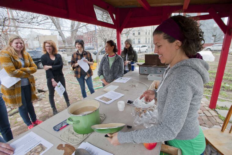 Jessica Noon, a volunteer at La Finquita, opens a pot of cream of sunchoke soup.