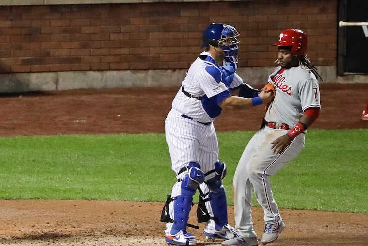 New York Mets catcher Wilson Ramos (40) tags out Philadelphia Phillies' Maikel Franco (7) before he reaches home plate during the fourth inning of a baseball game Tuesday, April 23, 2019, in New York. (AP Photo/Frank Franklin II)