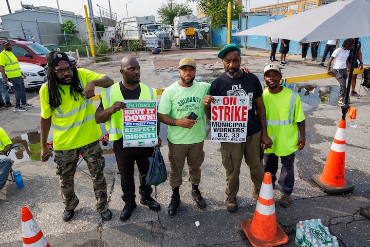 Philadelphia municipal workers from AFSCME District Council 33 form a picket line outside a Streets Department facility in the 3900 block of North Delaware Avenue on July 1.