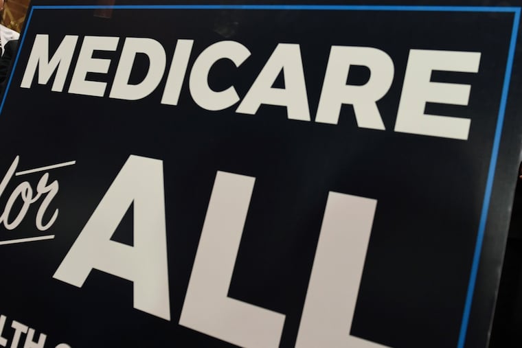 In this April 10, 2019 file photo, a sign is shown during a news conference to reintroduce "Medicare for All" legislation, on Capitol Hill in Washington. (AP Photo/Susan Walsh)