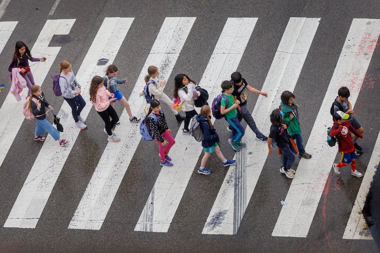 Students in the crosswalk at America's birthplace, Independence Hall. America's young people have faced a decline in health since the 1970s compared to similar countries, new CHOP research suggests.