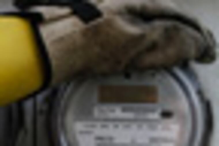 Steven Carbonara, a PECO field technician, installs an upgraded meter in a home in Bristol on April 10, 2011. PECO Energy Co. began installing the first generation of 6000,000 new-generation electric meters in March. They allow the company to give the customer more detailed information about their energy use. ( MICHAEL S. WIRTZ / Staff Photographer )