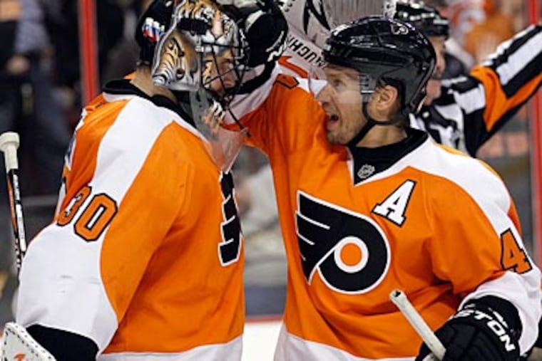 Ilya Bryzgalov and Kimmo Timonen celebrate the Flyers' victory over the Penguins on Thursday night. (Yong Kim/Staff Photographer)